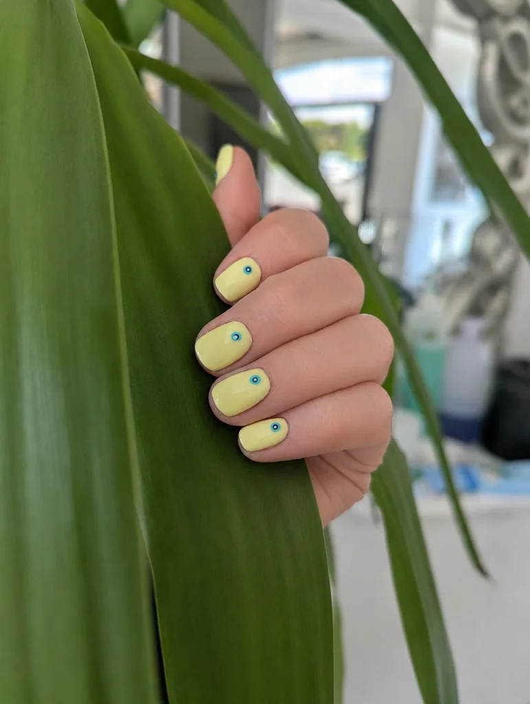 Vibrant yellow gel manicure by Leslie Quigley Beauty at Spawell